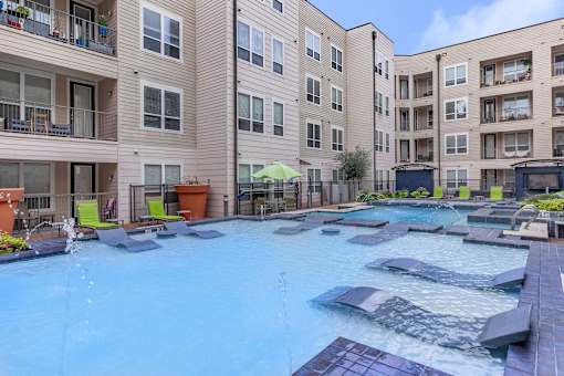 our apartments have a large swimming pool with lounge chairs
