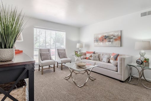 a living room with a couch and a table