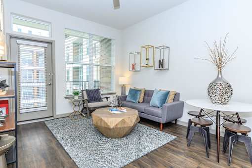 a living room with a couch and a round coffee table