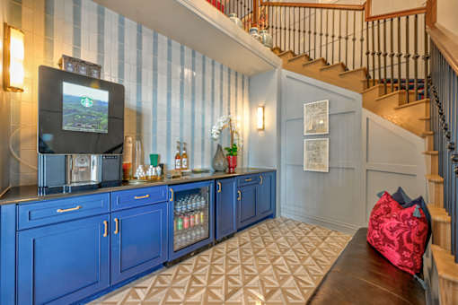 A blue cabinet with a TV on top of it.