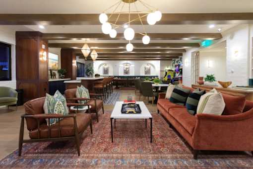 A living room with brown and green furniture.