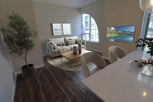 A living room with a couch, chairs, and a coffee table at Essex, Columbus, OH