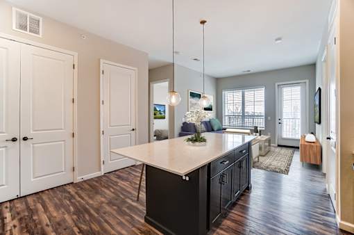 an open kitchen with an island and a living room at Essex, Columbus, Ohio