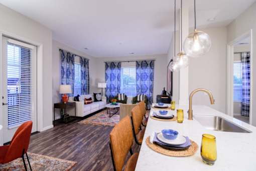 a kitchen and living room with a large table and a sink at Essex, Columbus, 43212