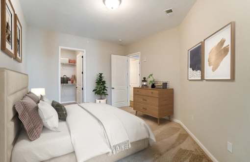 a bedroom with a white bed and a dresser at Essex, Columbus, OH, 43212