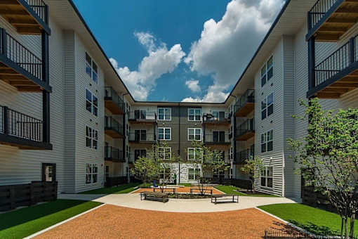 a courtyard in the middle of an apartment building at Taylor House Apartments, Columbus, OH, 43214