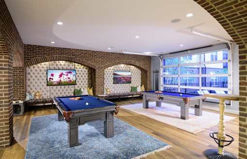 a game room with two pool tables and a flat screen tv at Taylor House, Ohio, 43214