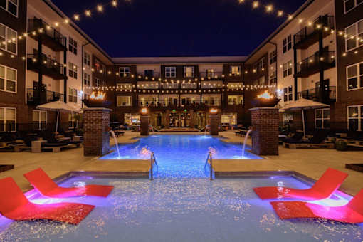 the pool at the hotel is lit up at nightat Taylor House Apartments, Columbus, Ohio