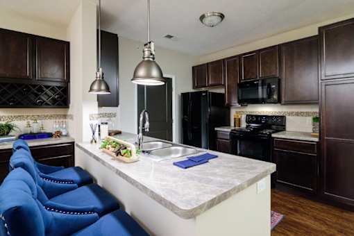 a kitchen with black appliances and a white counter top at Taylor House, Columbus, 43214