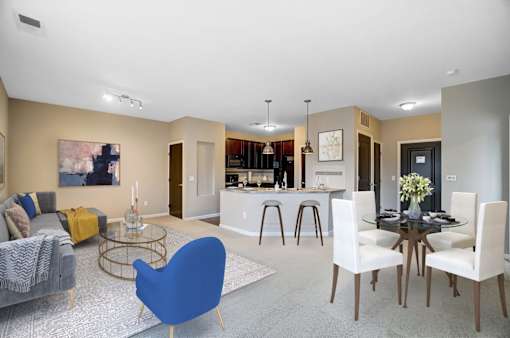 a living room and kitchen with a table and chairsat Taylor House Apartments, Columbus
