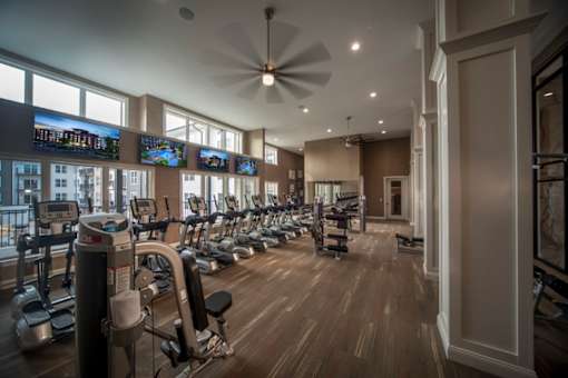a gym with cardio machines and a row of windows at Taylor House, Columbus, 43214