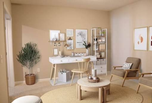 a living room with a desk and a chair