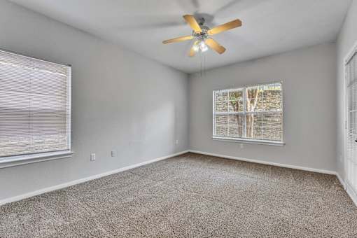 empty living room with a ceiling fan at Villas at Sonterra, San Antonio, TX
