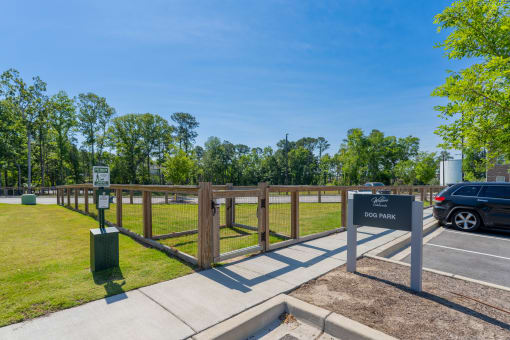 the preserve at ballantyne commons community entrance parking lot with fence and sign