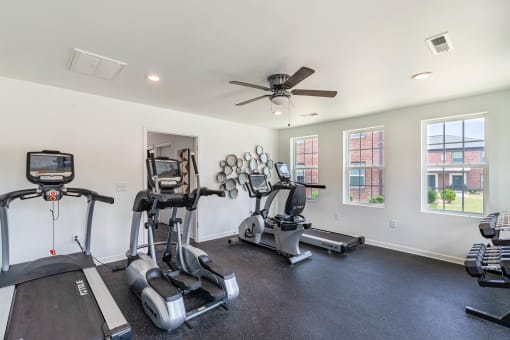 the gym with treadmills and cardio equipment at the preserve at great neck apartments