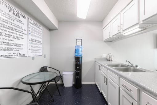 a kitchen with a sink and a table