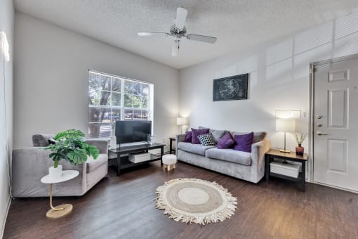 a living room with a couch and a tv