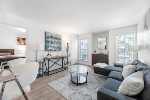 living room with a couch and a table  at Tall Timbers Apartments, Houston, TX 77015