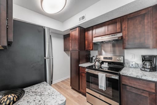 kitchen with stainless steel appliances at Tall Timbers Apartments, Houston, 77015