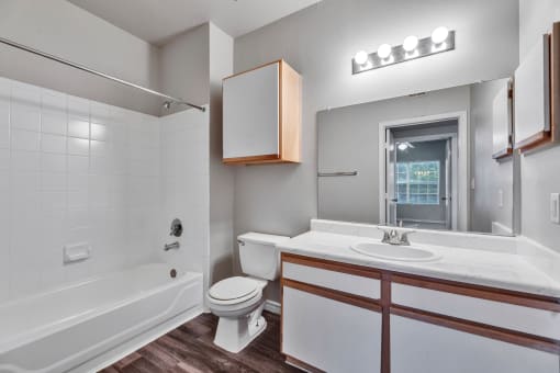 a bathroom with a sink toilet and a bath tub at Waters at Elm Creek, Texas 78230