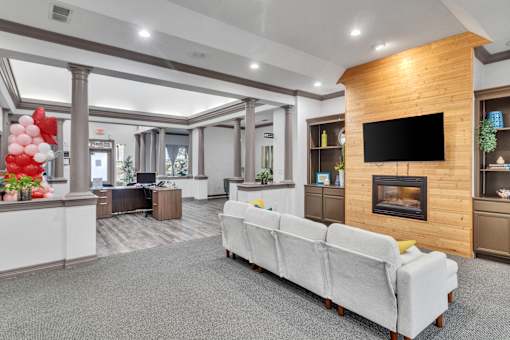A living room with a fireplace and a couch.