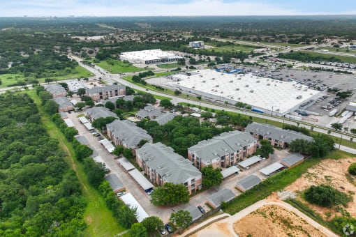 an aerial view of a neighborhood of houses in a city