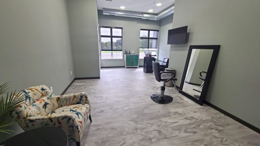 a living room with a couch and a mirror on the wall