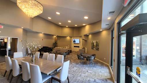 community room with tables and grand piano
