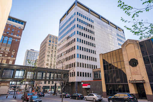 A city street with cars and buildings.