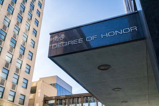 A building with a sign that says Degree of Honor.
