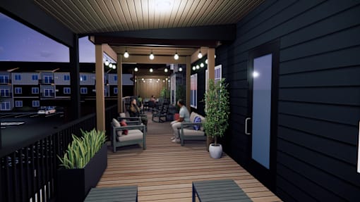 A group of people are sitting on a wooden deck.