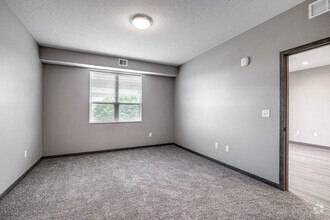 A room with a window and a door.