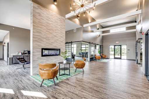 A modern living room with a fireplace and wooden floors.