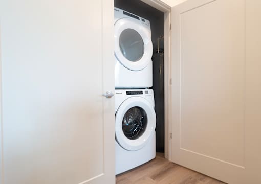 A white washing machine at Alta Apartments, Pewaukee, 53186