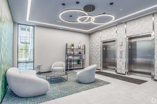 A modern waiting area with white chairs and a glass table at Bloom, Monona, WI