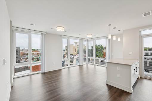 A spacious kitchen with a view of the city.
