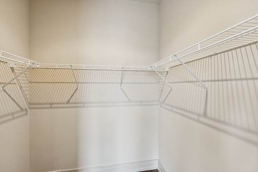 Empty white shelves in a room.