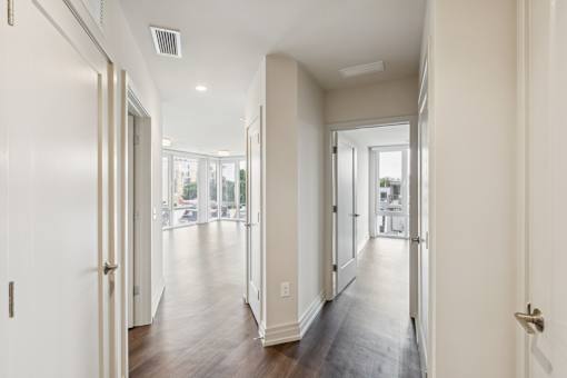A long hallway with doors on both sides.