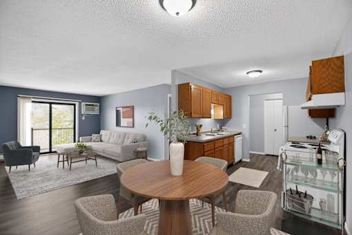 A modern living room with a dining table and chairs.