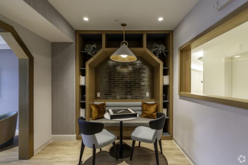 a dining room with a table and chairs