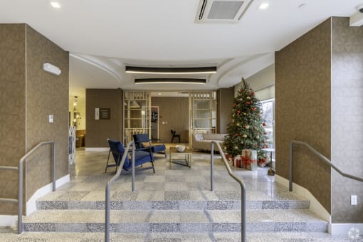 a christmas tree in the lobby of a building
