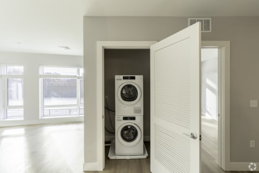 a laundry room with a washer and a dryer in a closet