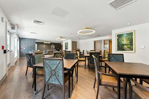A conference room with a long table and chairs.
