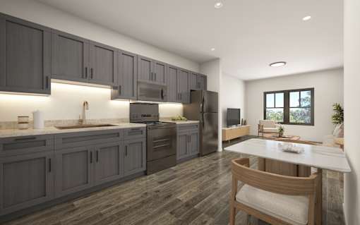 A modern kitchen with dark wood cabinets and a white countertop.