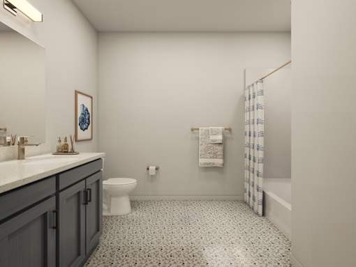 A bathroom with a toilet, sink, and shower.