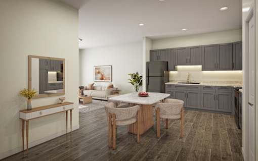 A modern kitchen with a dining table and chairs.