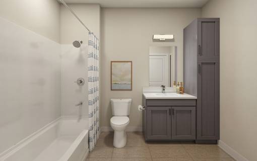 A bathroom with a toilet, sink, and shower.