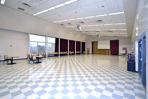 A room with a checkered floor and a white ceiling.