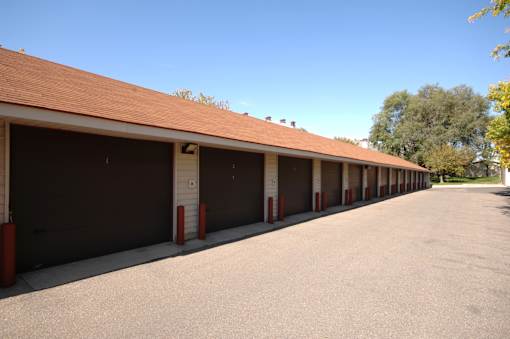 A long row of garage doors are closed.