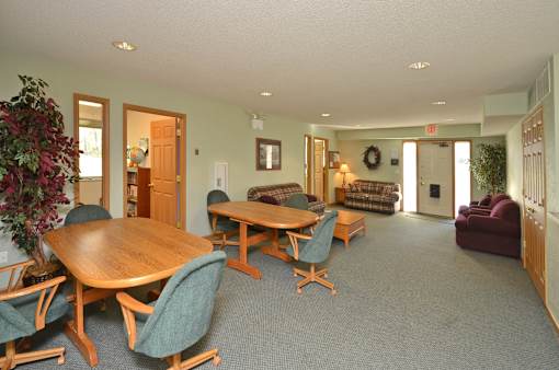 A room with a table and chairs.